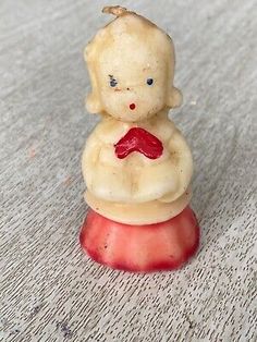 a small figurine sitting on top of a table