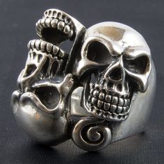 *  Twisted double skulls!      Right pair of freaks!*   Very unusual piece*  Hand made in our workshops in Devon*   Almost 3/4 ounce of  .925 fully hall marked sterling silver ring*  Available in M - Z*  Special Sizes are available on request Vintage Silver Skull Ring For Biker Events, Collectible Sterling Silver Skull Ring With Polished Finish, Collectible Silver Skull Ring In Stainless Steel, Collectible Silver Stainless Steel Skull Ring, Collectible Silver Skull Ring With Oxidized Finish, Silver Skull Ring Hand Cast For Anniversary, Silver Skull Ring For Anniversary, Anniversary Silver Skull Ring Hand Cast, Silver Engraved Jewelry For Biker Events