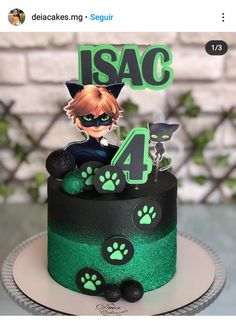 a green and black cake with an anime character on it's top tier is the number four