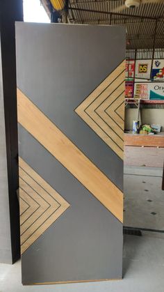 the door is made out of wood and has an arrow design on it's side