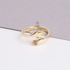 ABOUT PRODUCT  This 14K Gold Hug Ring is suitable gift for girlfriend, mom and her. You can even buy as a birthday gift for your friends or anniversary gifts, If you want to add a special note we can write for you and put to inside of package. We manufacture our jewelry pieces with carefully and after production we double checking in quality control department. Our main idea is keep our items for daily wearing especially for minimalist jewelry pieces. 14K Gold Hug Ring, Gift For Her, Gift For Women, Love Hugging Hands Ring, Girlfriend Gift, Two Hand Gold Ring, Mothers Day Gift, Moms Gift, Christmas, Valentine's Day Gift, Anniversary Gift, New Year, Mothers Day, Valentines Day, Birthday Gift, Fathers Day ITEM DETAILS Material: 14K Gold Approx: 1.70 gram Available colors: Gold, Rose Gold, Wh Meaningful Rings For Valentine's Day Gift, Mother's Day Gift Open Ring, Couple Rings For Mother's Day Gift, Valentine's Day Gift Couple Rings Open Ring, Valentine's Day Gift Couple Open Rings, Love Hugging, Hug Ring, Main Idea, Hand Ring