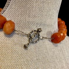 "This gorgeous carnelian choker features 27 large faceted amber color beads. Each bead is .625\" wide x .325\" thick. The over all length is approximately 17.75\". The tiny spacer beads are sterling silver. It is finished with a handmade silver toggle clasp. Length 16\" Width .625\" Additional Information: * Complimentary Gift Box! * All jewelry items come securely packaged and are mailed promptly upon payment - often same-day. * The majority of my vintage items are used and may show some wear. Spiritual Orange Jewelry With Faceted Beads, Faceted Amber Round Bead Jewelry, Gift Carnelian Faceted Beads, Adjustable Carnelian Jewelry With Faceted Beads, Faceted Orange Beaded Necklace As Gift, Amber Faceted Bead Necklaces For Jewelry Making, Faceted Amber Beaded Necklaces For Jewelry Making, Amber Faceted Beads For Jewelry Making, Orange Faceted Carnelian Necklaces