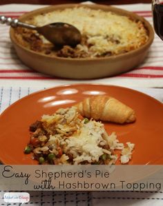 an orange plate topped with rice and meat next to a bowl filled with food on top of a table