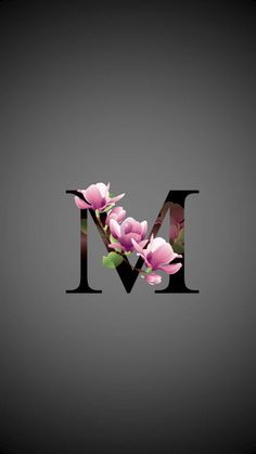 the letter m is made up of pink flowers on a gray background with black letters