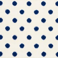 a white and blue polka dot fabric with small black dots on the top of it