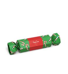 a green and red box with candy canes on it's wrapper is shown