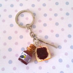 a piece of bread with jam on it and a keychain