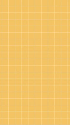 a yellow tiled wall with small squares