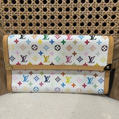 Stylish Louis Vuitton Wallet. Multicolor Monogram Design. Perfect For Any Occasion. Luxury White Wallets For Everyday Use, Luxury Multicolor Wallet For Daily Use, Luxury Multicolor Wallets For Travel, Luxury White Wallet For Travel, Designer White Rectangular Wallet, Luxury White Travel Wallet, Designer Multicolor Travel Wallet, Designer White Travel Wallet, Luxury White Wallet