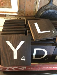 wooden signs with the letters y and d on them