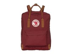 Fjallraven Kanken (Ox Red/Goose Eye) Backpack Bags Originally designed for Swedish school children the KÃnken pack has since stepped into the light as an iconic backpack for children and adults all around the world. Large main compartment to hold all your daily essentials. Front zip pocket for additional storage. Side slip pocket for water bottle. Dual top handles with snap closure for toting. Adjustable shoulder straps for a comfortable fit. F #Fjallraven #BagsandLuggage #Bag #Backpack #Red Fjällräven Kånken, School Yard, School Children, Kanken Backpack, Fjallraven Kanken, Fashion Icon, Daily Essentials, Fjallraven Kanken Backpack, All Around The World