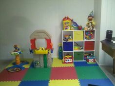 a play room with toys on the floor