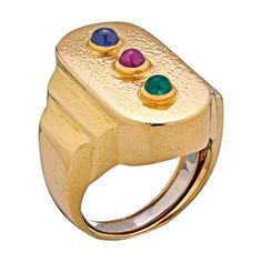 The top bezel-set round cabochon ruby, emerald, and sapphire mounted between 18K hammered finished gold. Signed Webb for David Webb. MATERIAL: 18K Yellow Gold SIZE: 7 WEIGHT: 17.1 CONDITION: Good. Circa: 1970's Sapphire Cabochon Ring, Multi Gem Ring, Cabochon Ruby, Sapphire Cabochon, Emerald Cut Diamond Ring, David Webb, Zero Tolerance, Ruby Emerald, Big Rings