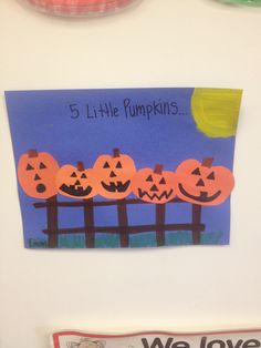 there are five pumpkins on the front of this refrigerator with magnets attached to it