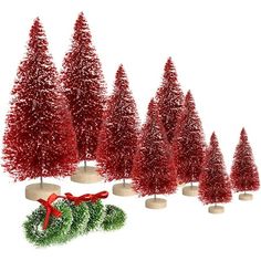 christmas trees with red tinsel on them