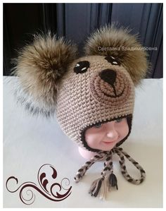 a crocheted hat with a pom - pom attached to the top