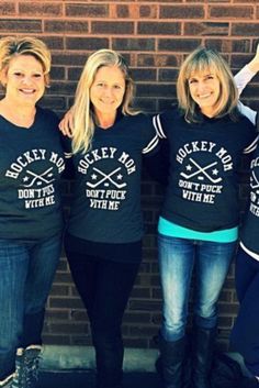 four women wearing t - shirts that say hockey mom, don't touch with me