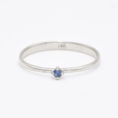 Dainty Sapphire Ring set with Natural Sapphire, size 2 millimeters diameter, 0.03 Carats. Solid 14k White Gold ☞ made to last. Click here for ☞ Solid Gold CollectionSapphire Details:• CERTIFIED Sapphire • Weight: 0.03 Carats• Dimensions: 2 millimeters• Color: Blue• Cut: Round�• Origin: BurmaSetting Details:• 1.20 grams of 14k Solid White Gold• Dimensions: Band width ≈ 2.2mm, thickness ≈ 0.7mm• Non-Tarnish - Perfect for Everyday Use - Lasts a Lifetime *Final weight & dimensions depending on the ch White Gold Sapphire Ring, Sapphire Solitaire Ring, Gold Letter Necklace, Sapphire Solitaire, Jewelry Safe, Solid Gold Jewelry, 14k White Gold Ring, Silver Gifts, White Gold Ring