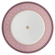 a pink and purple plate on a white background with gold trim around the edge,