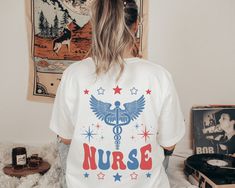 Nurse Shirt 4th of July Nurse Apparel Nursing TShirt Rn Shirt Nurse Top Retro Nurse T-Shirt Fourth of July Tee Medical Shirt Night Shift Nurse Womens Shirt QUICK  FACTS oBella Canvas 3001 Unisex T Shirt o100% Airlume combed and ringspun cotton  oLight Fabric. Retail fit. oTurn garment inside out. Wash and dry normally (on cool for best results). Do not dry clean. Do not iron. oActual product color may vary slightly from the listing photo due to monitor or mobile display. SIZING oAll items are un Medical Shirt, Pre-shrunk Nursing T-shirt With Crew Neck, Pre-shrunk Crew Neck Nursing Shirt, Night Shift Nurse, Nursing Clothes, Nursing Tshirts, Nursing Shirts, Fourth Of July, Vintage Looks