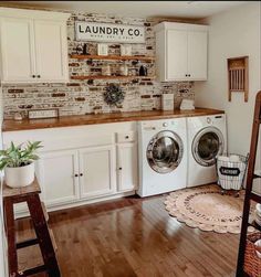 the laundry room is clean and ready to be used as a washer and dryer