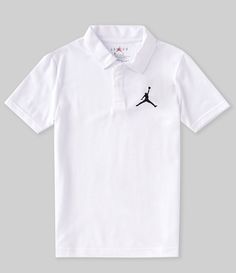 a white polo shirt with a black jordan logo on the chest and an air jordan embroidered on