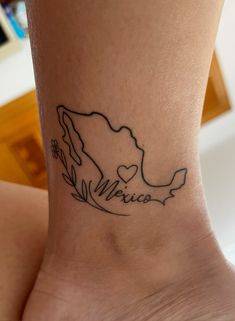 a woman's foot with a small tattoo on the side of her leg that reads venice