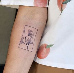 a person with a small tattoo on their arm