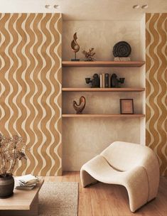 a living room filled with furniture next to a wall mounted book shelf on top of a hard wood floor