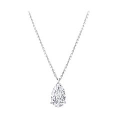 This exquisite pendant necklace features a stunning 4.22 carat pear cut diamond, gracefully suspended from a delicate 18K white gold chain. The diamond exhibits an E color grade, offering a near colorless brilliance that exudes sophistication. It's VS1 clarity ensures minimal inclusions, resulting in exceptional transparency and beauty. The excellent polish creates a flawlessly smooth surface that enhances the diamond’s radiant sparkle. With very good symmetry, the facets are precisely aligned, Luxury White Gold Teardrop Pendant Necklace, Luxury Oval Platinum Diamond Necklace, Pear Diamond Pendant, Expensive Jewelry Luxury, Pear Cut Diamond, Jewelry Luxury, Expensive Jewelry, Pear Diamond, Fine Jewels