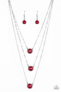 Three red pearl drop pendants layer down the chest in a refined fashion. Features an adjustable clasp closure.

Sold as one individual necklace. Includes one pair of matching earrings. Pearl Drop Pendant, Refined Fashion, Hanging Necklaces, Red Pearl, Summer Closet, Necklace Sets, Red Necklace, Paparazzi Accessories, Paparazzi Jewelry