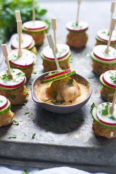 small appetizers with toothpicks in them on a tray