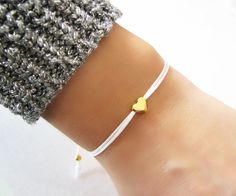 Tiny Heart Bracelet, Friendship Bracelet, Cord Bracelet, Bridesmaid Gift ♥Buy 2 Jewelry and Get 1 FREE♥ CODE: GET1FREE Put all 3 items in your cart and apply shop coupon code at checkout. In this way 1 item will be free of cost as you will receive 33% discount. (Except Category 925 Silver Necklaces) A lovely bracelet which you can wear alone or together with others! ♥ Made from 6mm gold plated heart charm. ♥ 1mm Satin cord. ♥ Two gold plated beads at the ends. ♥ The bracelet is adjustable and it Diy Rhinestone Earrings, Tiny Heart Bracelet, Friendship Bracelet Adjustable, Adjustable Cord Bracelet, Aniversary Gifts, Bracelet Cordon, Rhinestone Choker Necklace, Real Flower Jewelry, Bracelet Friendship