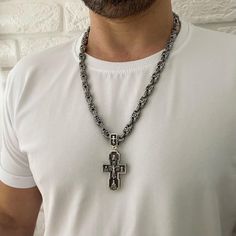 "Material: 925 Sterling Silver Weight: 150 gr. Width: 8/9mm Silver Orthodox cross. Silver 925 with blackening. Weight 57 grams (+ -) The size: 7 / 3.2 cm (with eyelet) 5 / 3.2 cm (excluding the lug) The cross depicts: Savior Not Made by Hands Crucifixion of jesus christ Kazan Icon of the Mother of God Nicholas the Wonderworker Sergius of Radonezh archangel Michael Prince Vladimir Archangel Gabriel George the Victorious At the end of the cross there is a prayer: \"Lord Jesus Christ, Son of God, H Silver Cross Pendant Necklace With Box Chain, Silver Chain Cross Metal Jewelry, Silver Chain Metal Cross Jewelry, Silver Cross Pendant Chain Jewelry, Metal Cross Jewelry With Silver Chain, Metal Cross Jewelry With Box Chain, Silver Metal Crucifix Necklace, Sterling Silver Cross Box Chain Necklace, Silver Pendant Cross Necklace With Chain