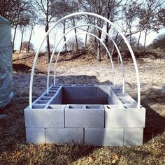 an outdoor fire pit made out of cinder blocks