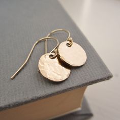 These simple disc earrings are perfect for everyday wear! Hand hammered finish Choose from: ~sterling silver ~14K yellow gold filled ~14K rose gold filled Discs measure 9mm in diameter. >>To enter to my shop<< http://www.kgarnerdesigns.etsy.com Please contact me PRIOR TO PURCHASE if you are ordering on a deadline. I can usually accommodate quick shipping if I am made aware of your deadline. *Expedited shipping is available during checkout.* Most items are ready to ship 2 business day Everyday Hammered 14k Gold Filled Earrings, Simple Hammered Everyday Earrings, Simple Everyday Hammered Earrings, Simple Hammered Rose Gold Jewelry, Minimalist Hammered Round Disc Earrings, Everyday Hammered Rose Gold Earrings, Everyday Rose Gold Hammered Earrings, Hammered 14k Gold-filled Rose Gold Earrings, Simple Hammered Round Earrings