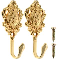 two gold coat hooks with screws on each side and an image of a woman in the center