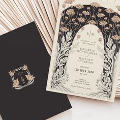 the wedding stationery is laid out on top of each other