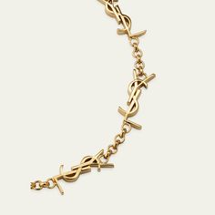 Saint Laurent chain bracelet Shiny brass with a gold-tone finish Features signature YSL logo stations Adjustable length Lobster clasp Imported Yellow Gold Chain Link Jewelry With Gold-tone Logo, Elegant Gold-tone Chain Link Jewelry With Logo Plaque, Elegant Gold-tone Chain Link Jewelry, Designer Gold Metal Chain Bracelet, Designer Gold Chain Bracelet, Designer Gold Bracelets With Logo Charm, Gold-tone Metal Bracelets With Logo Charm, Luxury Gold-tone Bracelet With Logo Charm, Designer Metal Bracelets With Logo Charm