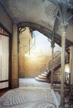 an ornate staircase leading to the second floor