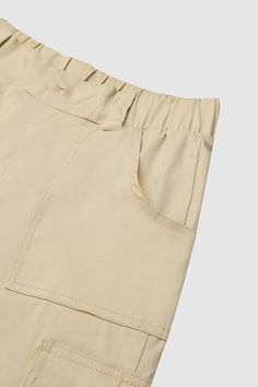 Flap Pocket Taped Low Waist Bermuda Shorts Casual Paperbag Waist Bottoms With Pockets, Casual Workwear Shorts With Multiple Pockets, Casual Bottoms With Cargo Pockets And Paperbag Waist, Relaxed Fit Paperbag Waist Bottoms With Pockets, Utility Paperbag Waist Bottoms With Pockets, Casual Cargo Pants With Paperbag Waist, Casual Khaki Paperbag Waist Bottoms, Beige Short Pants With Pockets, Paperbag Waist Shorts With Pockets For Work