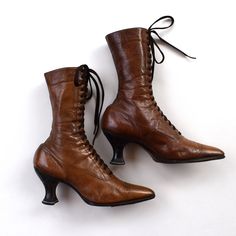 "This listing is for a pair of antique thin brown leather lace up high ankle Edwardian boots lined with cotton twill. These are very narrow with a sharp pointed toes, full lace front, Louis heel and narrow ankles. These boots have 19 grommets and perforated decoration at the toe. Their tongues are lined with cotton fabric. I didn't find a size or maker mark on these antique boots, only numbers inside: 242 51409. The leather and cloth are supple but the stitching is undone on the top of the right boot. The boots are about 12 1/2\" tall by 2 3/4\" wide at the widest part of the sole and the length of the sole is about 9 1/2\" long. The leather is very thin and very soft. These boots were a part of a nice Edwardian collection of one of the estate sales. When I found them, they were stuffed wi Witchy Shoes, Edwardian Boots, Brown Leather Lace Up Boots, Granny Boots, Victorian Boots, Shabby Style, Leather Lace Up Boots, Boots Brown, Brown Leather Boots