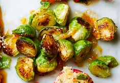 the brussel sprouts are being served with sauce