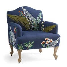 a blue chair with floral designs on it