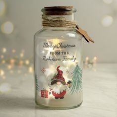 a glass jar with a christmas message on it