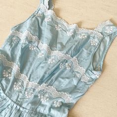 "Baby blue beauty. This super sweet light cotton frock has cotton scallop lace details on its bodice that really brings it to next level loveliness. Back metal zip. Condition: Excellent Label: None. Well made. Bust 33/34\" Waist 24\" Length 39\" (4\" to let) This item is clean and ready to wear. Comes from a smoke and pet free home. Don't forget to follow me on Instagram @tammaraclearshercloset for new listing alerts. This is shipping from Singapore. Standard post to the US takes about 10 workin Spring Cotton Dress With Scalloped Lace, Cotton Scalloped Lace Fitted Dress, Fitted Cotton Dress With Scalloped Lace, Fitted Cotton Dress With Scalloped Edges, Fitted Light Blue Dress With Lace Trim, Summer Cotton Dresses With Scalloped Lace, Summer Cotton Dress With Scalloped Lace, Sleeveless Cotton Dress With Lace Work, Cotton Summer Dresses With Scalloped Edges