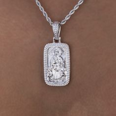 Introducing the Icon Shepherd Pendant, a statement piece in 14k White Gold. This piece features intricately designed imagery of the Shepherd with an iced out halo, a Cuban link border and finished with an iced out bail. This standout piece is a must have and pairs perfectly with our 4mm Rope Necklace. This product is guaranteed for life - GLD will repair the item should you experience any defects in craftsmanship or breakage. Specifications - 18mm x 30mm (Width x Height) - Weight: (Weight can va White Iced Out Sterling Silver Jewelry, Iced Out White Sterling Silver Jewelry, Luxury Silver Jewelry With Halo Detail, Luxury Silver Halo Jewelry, Iced Sterling Silver Jewelry In Diamond White, Iced Diamond Gold Jewelry, Iced Out White Pendant Jewelry, White Iced Jewelry For Anniversary, White Embellished Jewelry For Anniversary