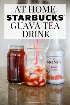 three mason jars filled with drinks sitting on top of a counter next to a sign that says at home starbucks guava tea drink