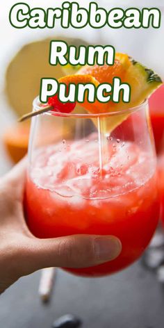 someone is holding a drink in their hand with the words, caribbean rum punch