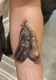 a woman's leg with a tattoo of a monkey on it and the bottom half of her arm